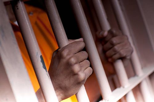 Prison Hands 2  jail cell stock pictures, royalty-free photos & images