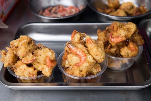 Vibrant Quanzhou street market with coastal food stalls