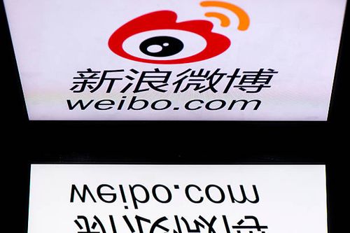 The chinese app Weibo's logo is displayed on a tablet on January 2, 2014 in Paris. AFP PHOTO / LIONEL BONAVENTURE