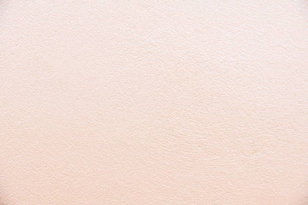 texture and background of creamy white old cement wall - fondo color crema fotograf&iacute;as e im&aacute;genes de stock