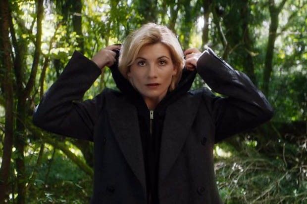 Jodie Whittaker lowering her hood as she's announced as the Thirteenth Doctor