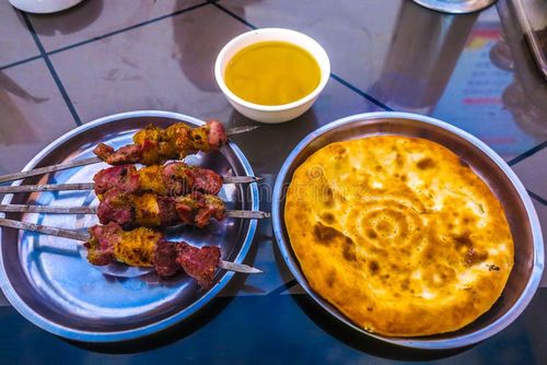Uyghur lamb skewers on a grill in Kashgar bazaar