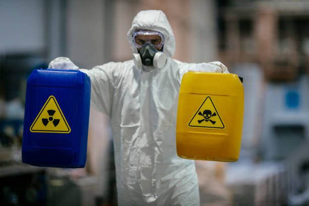 factory worker wearing gas mask and radioactive protection suit - radioactive stock pictures, royalty-free photos & images
