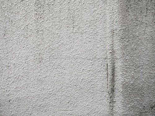 薄汚れたモルタル壁（テクスチャ）の写真