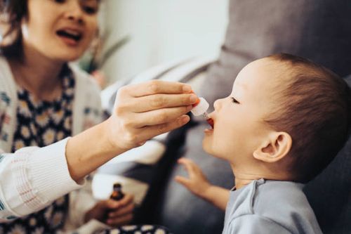 baby receiving oral medicine - patient taking medicine stock pictures, royalty-free photos & images