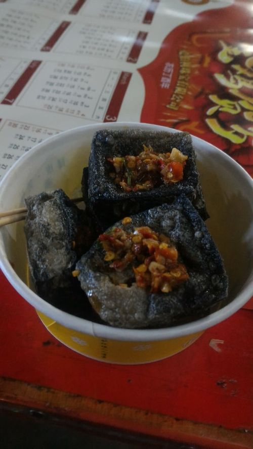 Crispy black stinky tofu cubes