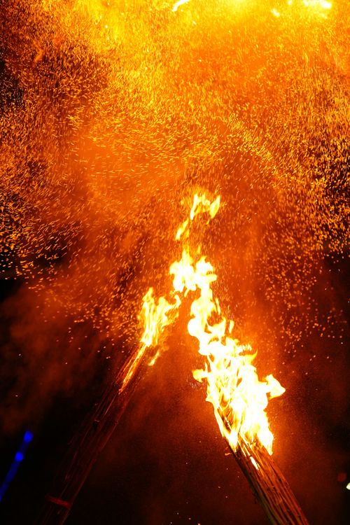 Fiery explosion with sparks and flames at night