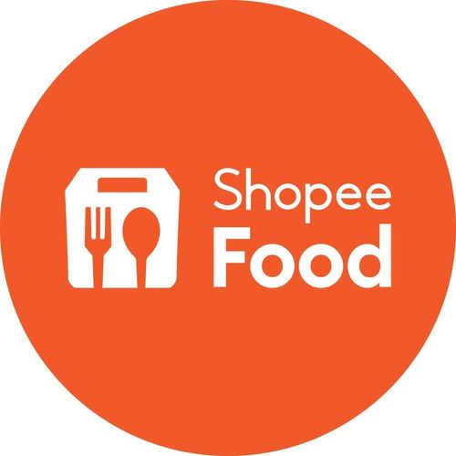 an orange circle with the words shopee food in white on it and a fork, knife and spoon