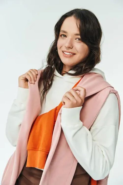 Stylish Young Woman Smiles She Adjusts Her Colorful Outfit Bright — Stock Photo, Image