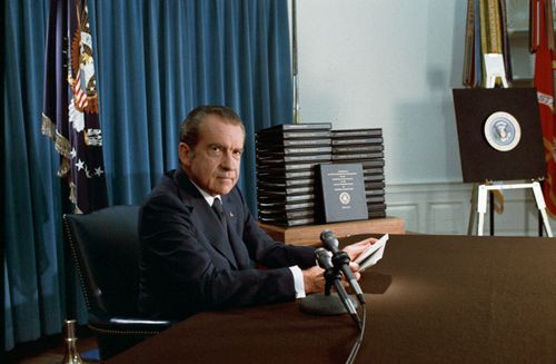 Nixon seated in the Oval Office, explaining the release of edited transcripts