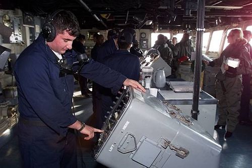 Navy Specialist David Holland checks a radar screen for surface contacts on the bridge of the USS Austin as crews continue the search for the cockpit...