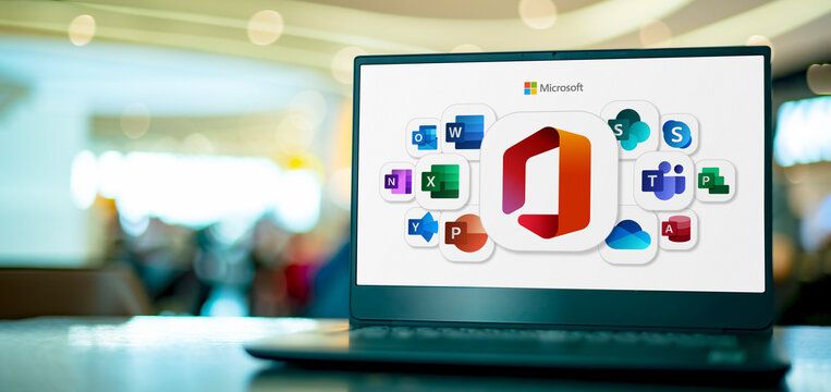 Laptop computer displaying logos of Microsoft Office