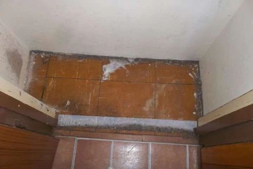 Asbestos floor tiles in cupboard of flat