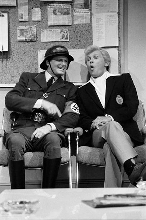 Episode 10 -- Pictured: Rob Riley as Nazi, Billy Crystal as Fernando Lamas during the 'Green Room' skit on January 12, 1985 --