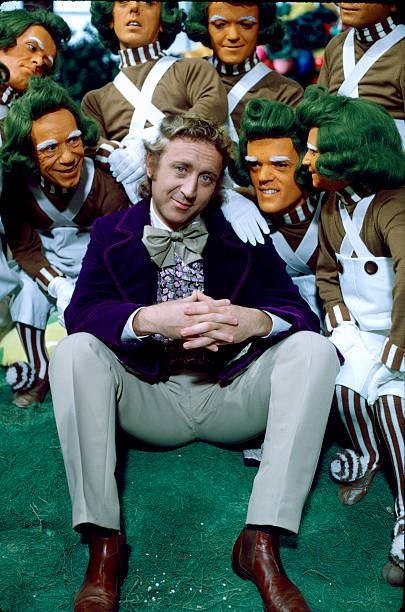 Gene Wilder as Willy Wonka surrounded by a group of Oompa Loompas, on the set of the movie Willy Wonka & the Chocolate Factory, 1971.