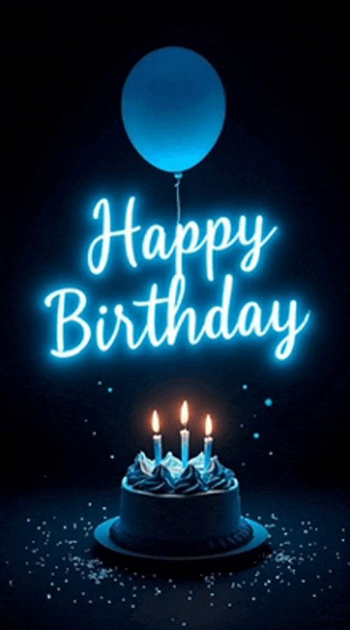 a birthday cake with candles and a blue balloon with the words happy birthday