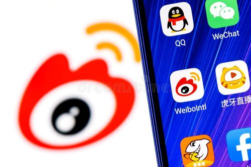 Kazan, Russia - Mar 10, 2022: The icon of the Weibo chinese microblogging service application among other applications on smartphone screen. On background is Weibo logo. Weibo app stock images, royalty-free photos and pictures