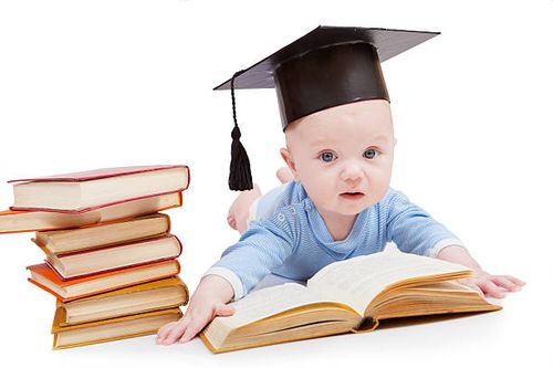 kid in a hat of the bachelor and book kid in a hat of the bachelor and the book. Concept of early educationkid in a hat of the bachelor and the book. Concept of early education bachelor of science stock pictures, royalty-free photos & images