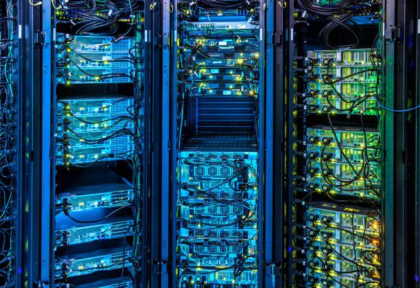 Illuminated Server Room Illuminated Servers in Server Room super computer stock pictures, royalty-free photos & images