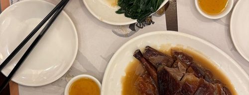 Interior of a cozy Sham Shui Po diner with roast meats