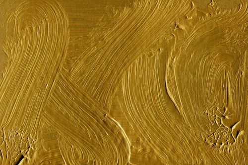 Photo gold acrylic texture painted on cardboard paper background