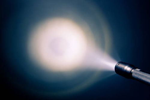 A small pocket flash light shining on the wall focused glowing pocket torch light torch stock pictures, royalty-free photos & images