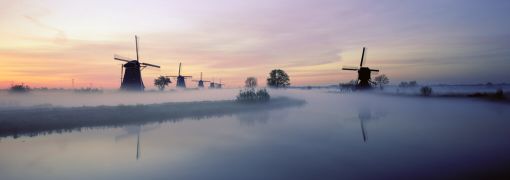 Netherlands, Europe, Holland, Zuid Holland, Row of Windmills and canal, Kinderdijk