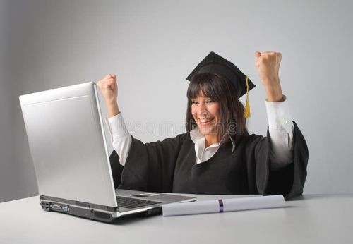 Portrait of female graduate working with laptop. Bachelor degree stock images, royalty-free photos and pictures