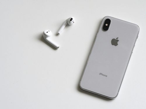 Silver iphone x with airpods. apple in store return policy