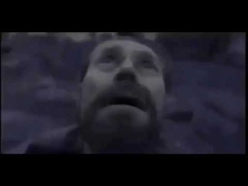 Willem Dafoe looking up