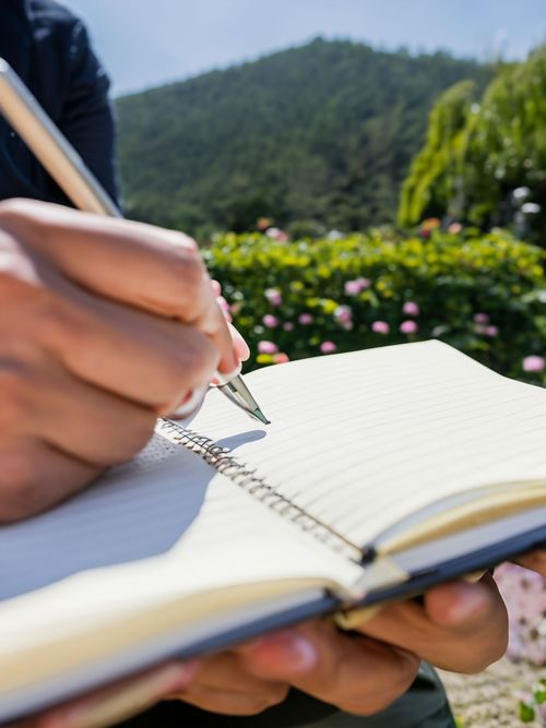 Writing in Nature FREE Stock Photo, writing, notebook, nature picture