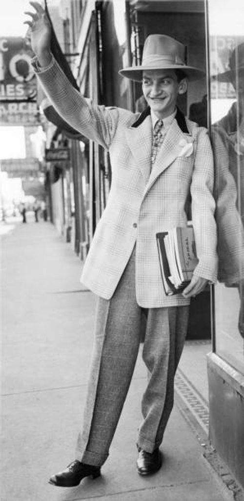 Man wearing the very latest in zoot-suit styles and a hat to match, Chicago, Illinois, September 24, 1943. The new style reflects War Production...