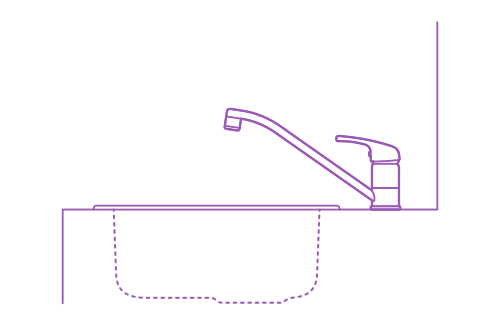 Side view of the IKEA Lagan Kitchen Faucet installed with a kitchen sink