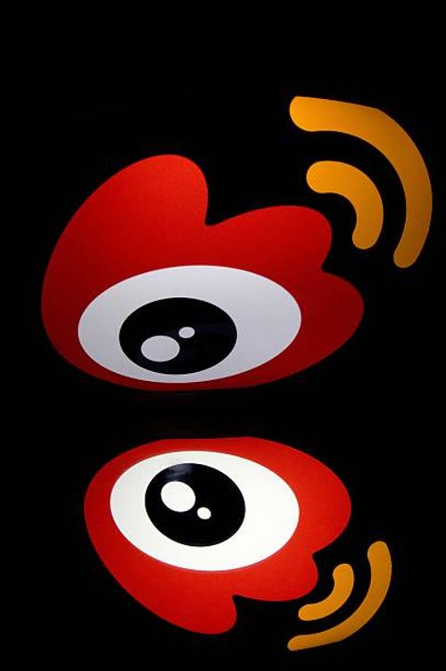 The chinese app Weibo's logo is displayed on a tablet on January 2, 2014 in Paris. AFP PHOTO / LIONEL BONAVENTURE