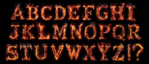 Fire font alphabet made of burning letters on black background.