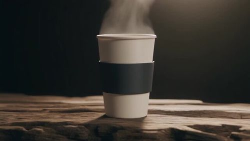 Steaming Hot Coffee Cup on Rustic Wooden Table