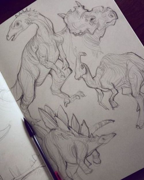 a drawing of some dinosaurs on a piece of paper