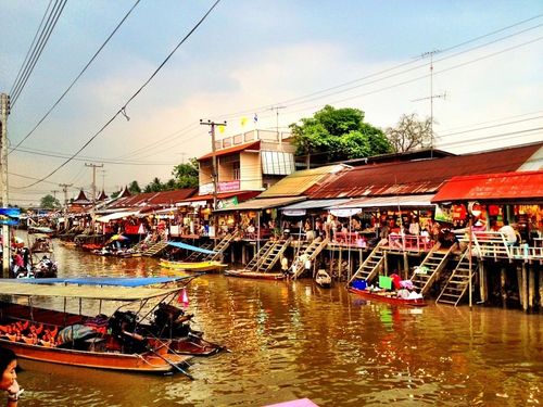Boats laden with goods at a bustling China waterway market