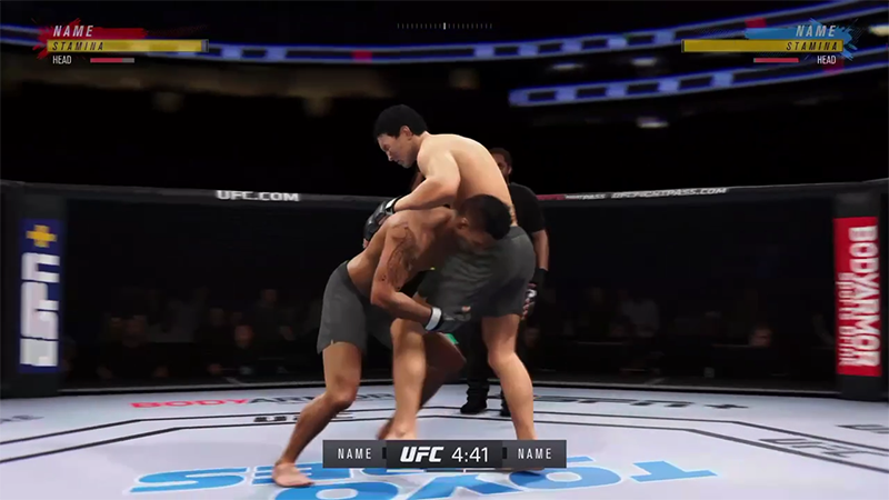 A fighter lifting his opponent by the waist to perform a takedown in the Octoagon.