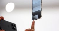 Apple to raise prices due to memory chip shortage, CEO Cook tells WSJ - Reuters