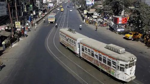 AFP A tram rolls along a main road which is usually jammed with traffic, during a 12-hour general strike in Kolkata on January 22, 2009.