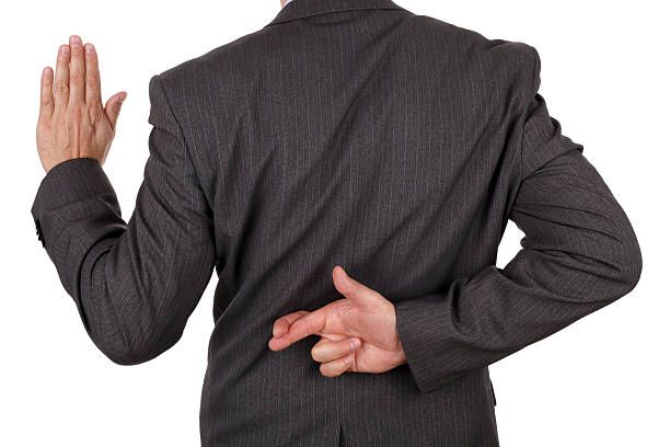 fraude de negocios - doble-cara fotografías e imágenes de stock