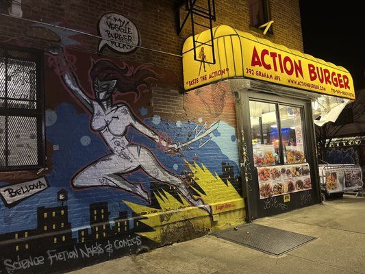 Action Burger - a woman with a sword in her hand on the side of a building - Brooklyn, NY