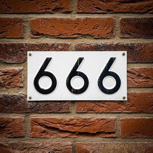 Number 666 house number six hundred and sixty six embossed in a metal plate. The number of the beast. number 666 stock pictures, royalty-free photos & images