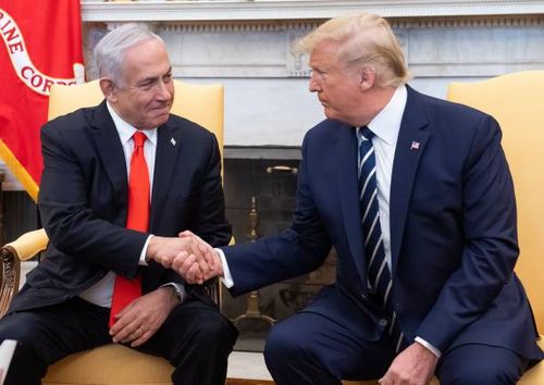 President Donald Trump shakes hands with Israeli Prime Minister Benjamin Netanyahu as they hold a meeting in the Oval Office of the White House in...