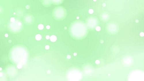 Soft green pastel bokeh wedding background, dreamy light, elegant sparkles, perfect for invitations, greeting cards, modern event designs, and romantic moments.