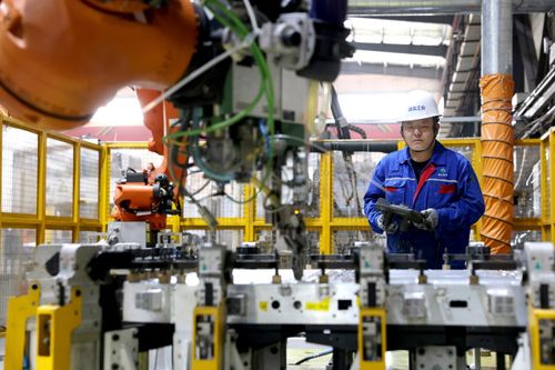 Robots manufacture power battery casing products for NEVs at a new energy technology company in Ningde, Fujian Province, China, February 17, 2025. /VCG