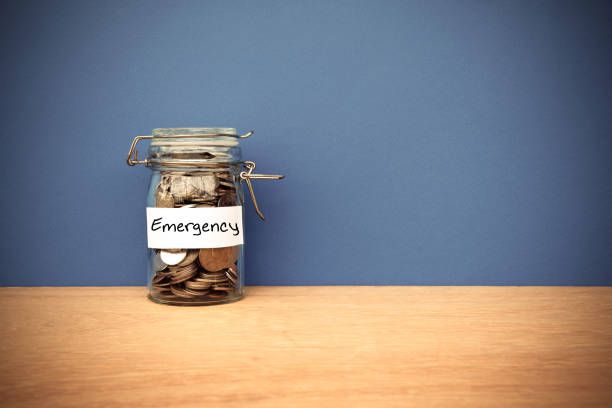 coins jar for emergency savings - finance savings jar stock pictures, royalty-free photos & images