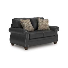 Signature Design by Ashley Chatterton Rustic Faux Leather Loveseat with Nailhead Trim and 2 Throw Pillows, Reinforced Frame for Added Stability, Reversible Seat Cushions, Turned Legs, Black