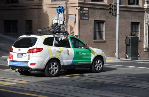 Google Maps Street View vehicle with camera mounted on its roof records images as it proceeds down Bush Street in San Francisco, California.
